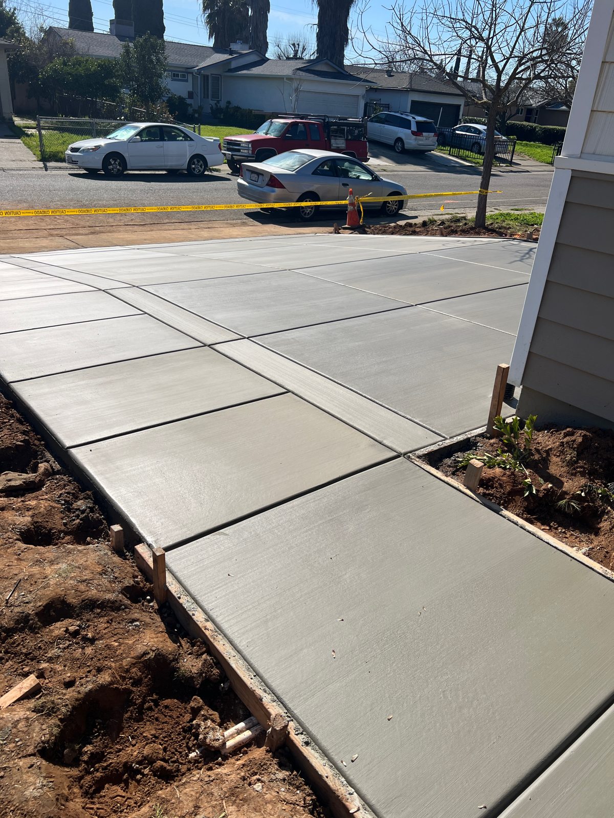 Neat control joints give this concrete path a measured, orderly finish.