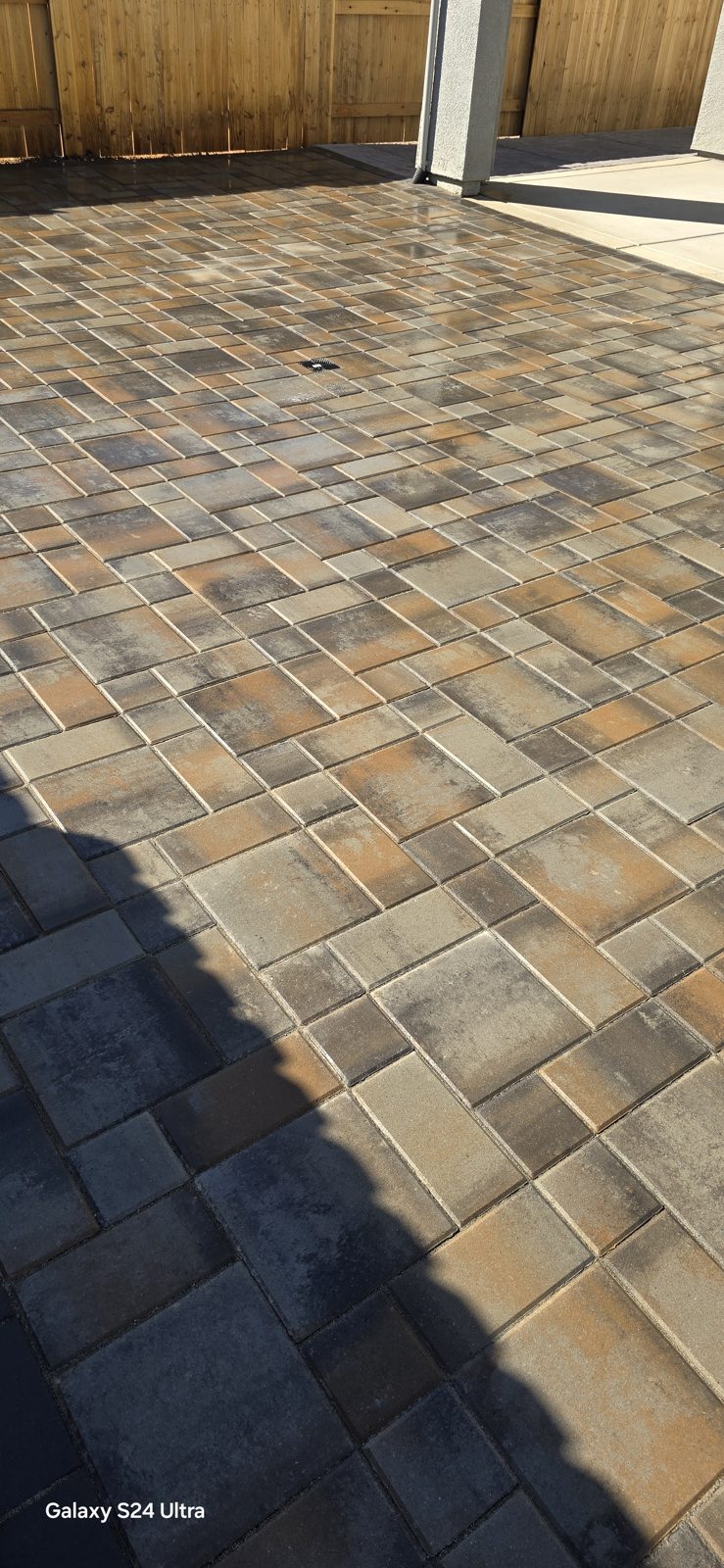 Warm, varied paver tones add depth and character to a private patio.