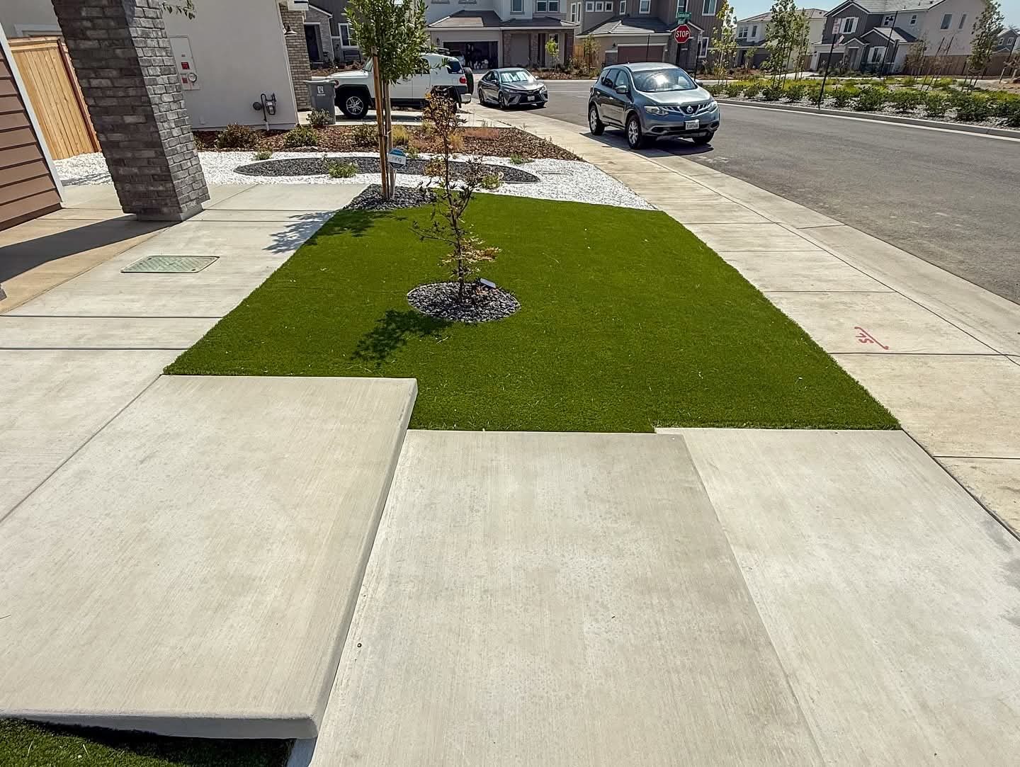 A narrow green verge brings color and definition to the front walkway.