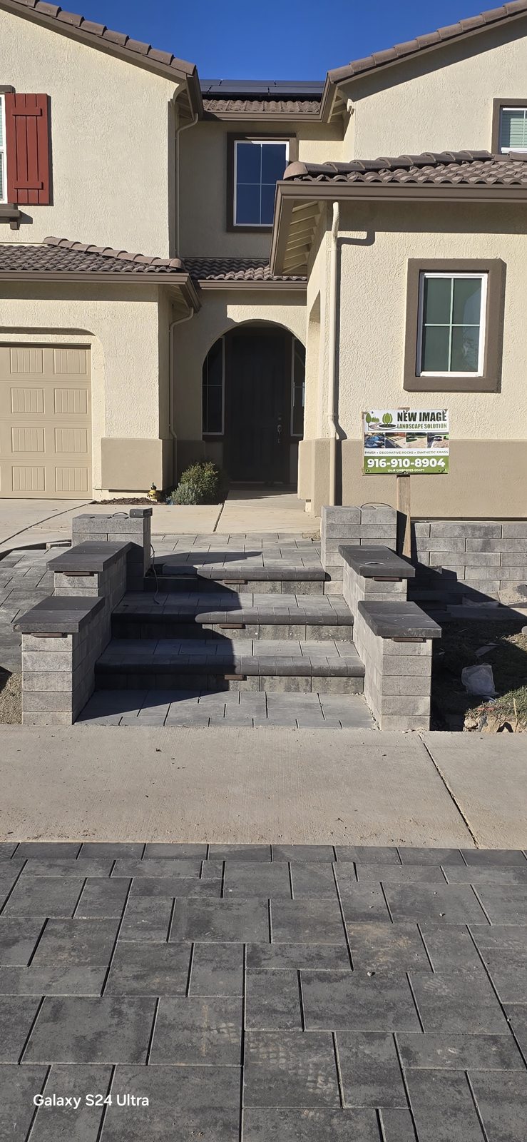 Layered entry steps bring scale and definition to the front approach.